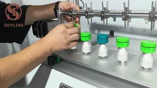 Tester per cerniere per tappi per cosmetici